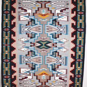 Colorful geometric patterned textile with intricate designs.